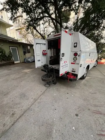 Magnet Plumbing service vehicle on-site for Grease Trap Cleaning in Home Gardens